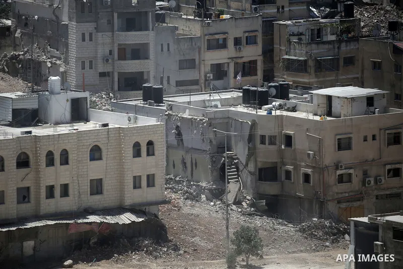 Israeli army heavy machinery demolishes a home at the Nur Shams Palestinian refugee camp, east of Tulkarem, in the Israeli occupied West Bank on June 25, 2025, during an ongoing military operation in the north of the Pal...