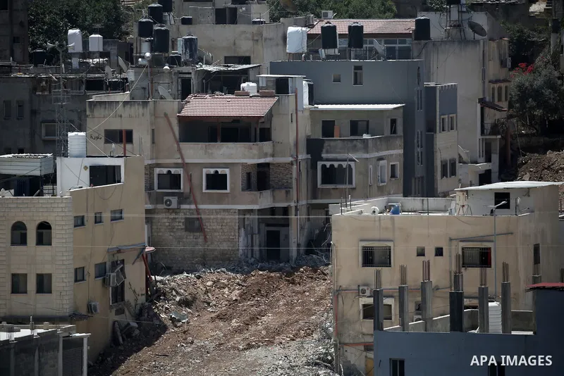 Israeli army heavy machinery demolishes a home at the Nur Shams Palestinian refugee camp, east of Tulkarem, in the Israeli occupied West Bank on June 25, 2025, during an ongoing military operation in the north of the Pal...