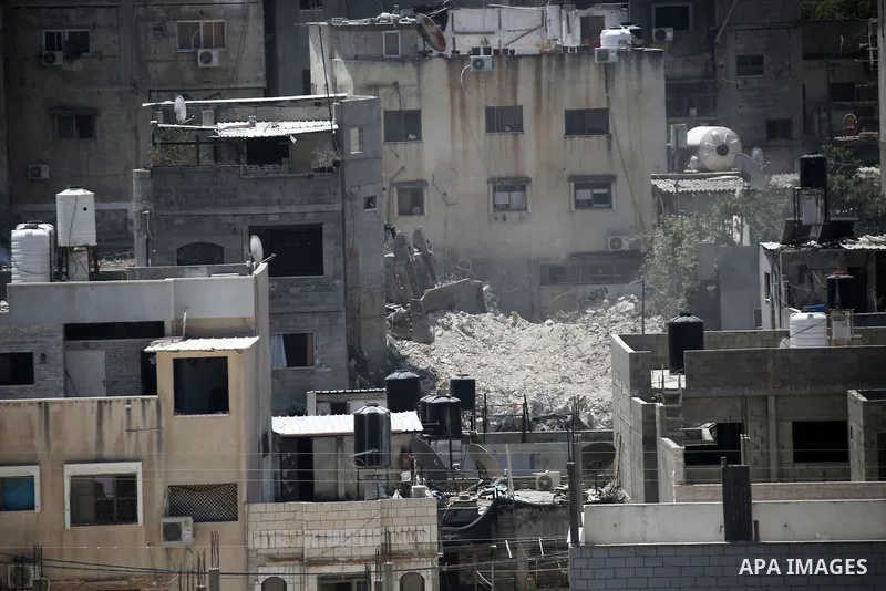 Israeli army heavy machinery demolishes a home at the Nur Shams Palestinian refugee camp, east of Tulkarem, in the Israeli occupied West Bank on June 25, 2025, during an ongoing military operation in the north of the Pal...