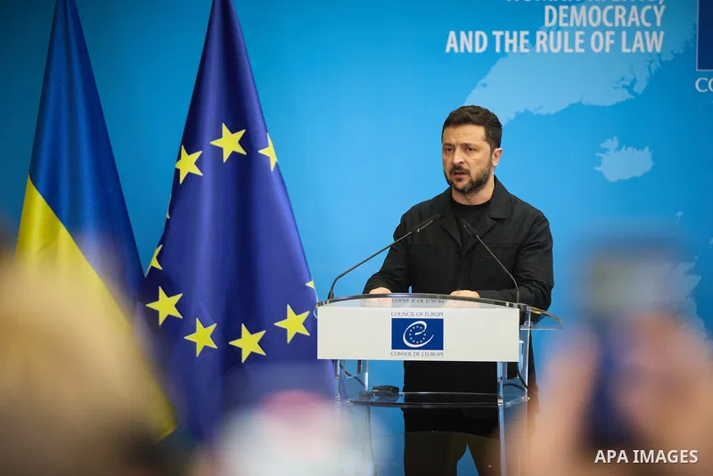 Ukrainian President Volodymyr Zelenskyy, with Council of Europe Secretary General Allen Peers, signs an agreement to establish a special tribunal for the crime of aggression against Ukraine, in The Hague, Netherlands, on...