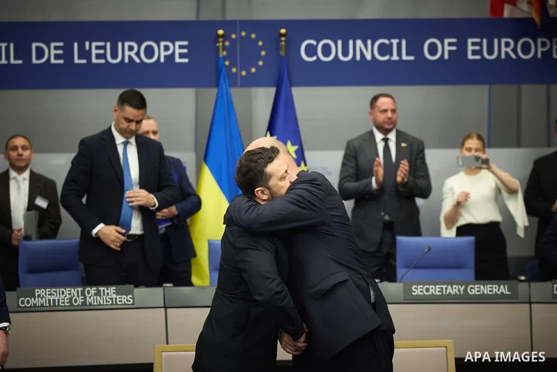Ukrainian President Volodymyr Zelenskyy, with Council of Europe Secretary General Allen Peers, signs an agreement to establish a special tribunal for the crime of aggression against Ukraine, in The Hague, Netherlands, on...