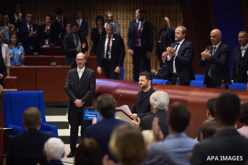 Ukrainian President Volodymyr Zelenskyy, with Council of Europe Secretary General Allen Peers, signs an agreement to establish a special tribunal for the crime of aggression against Ukraine, in The Hague, Netherlands, on...