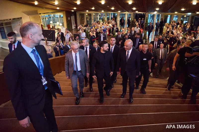 Ukrainian President Volodymyr Zelenskyy, with Council of Europe Secretary General Allen Peers, signs an agreement to establish a special tribunal for the crime of aggression against Ukraine, in The Hague, Netherlands, on...