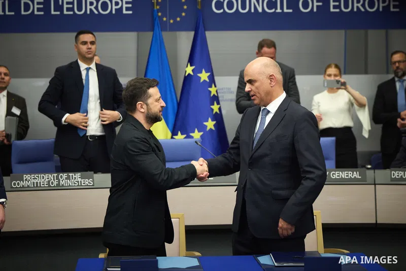 Ukrainian President Volodymyr Zelenskyy, with Council of Europe Secretary General Allen Peers, signs an agreement to establish a special tribunal for the crime of aggression against Ukraine, in The Hague, Netherlands, on...