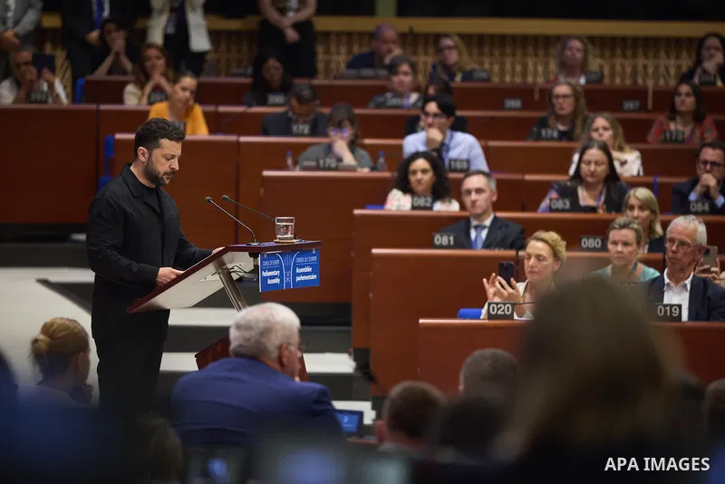 Ukrainian President Volodymyr Zelenskyy, with Council of Europe Secretary General Allen Peers, signs an agreement to establish a special tribunal for the crime of aggression against Ukraine, in The Hague, Netherlands, on...