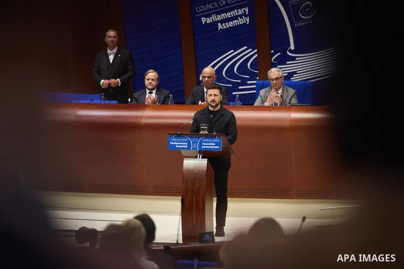 Ukrainian President Volodymyr Zelenskyy, with Council of Europe Secretary General Allen Peers, signs an agreement to establish a special tribunal for the crime of aggression against Ukraine, in The Hague, Netherlands, on...