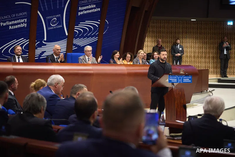 Ukrainian President Volodymyr Zelenskyy, with Council of Europe Secretary General Allen Peers, signs an agreement to establish a special tribunal for the crime of aggression against Ukraine, in The Hague, Netherlands, on...