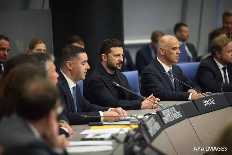 Ukrainian President Volodymyr Zelenskyy, with Council of Europe Secretary General Allen Peers, signs an agreement to establish a special tribunal for the crime of aggression against Ukraine, in The Hague, Netherlands, on...