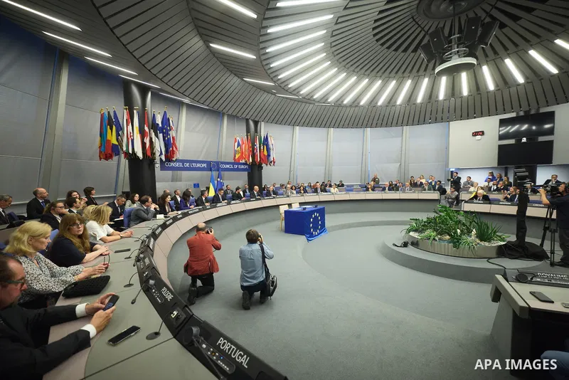 Ukrainian President Volodymyr Zelenskyy, with Council of Europe Secretary General Allen Peers, signs an agreement to establish a special tribunal for the crime of aggression against Ukraine, in The Hague, Netherlands, on...