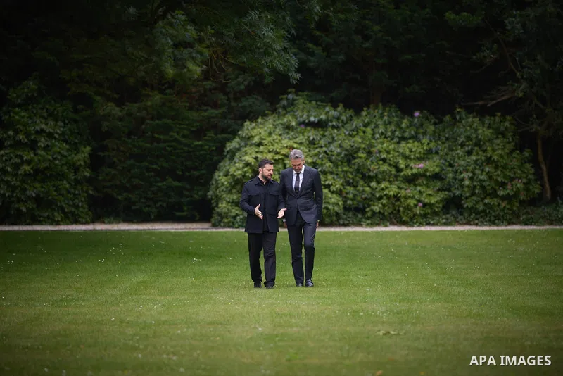 Ukraine's President Volodymyr Zelensky (L) speaks with Netherlands' outgoing Prime Minister Dick Schoof (R) during their bilateral meeting in the gardens of the Catshuis official residence on the sidelines of the two-day...