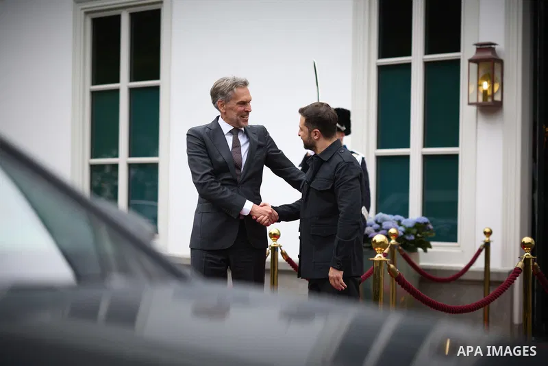 Ukraine's President Volodymyr Zelensky (L) speaks with Netherlands' outgoing Prime Minister Dick Schoof (R) during their bilateral meeting in the gardens of the Catshuis official residence on the sidelines of the two-day...