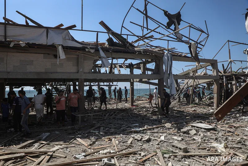 Palestinians inspect Al-Baqa Cafe after it is targeted by an Israeli airstrike in western Gaza City, on June 30, 2025, as the war between Israel and the Hamas Islamist militant movement continues. Photo by Omar Ashtawy\...
