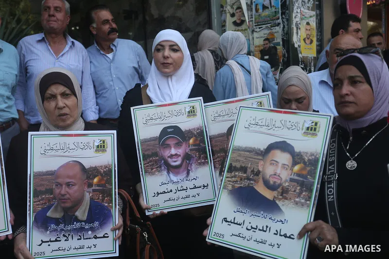Relatives of Palestinian prisoners hold photos of their loved ones held in Israeli jails during a solidarity rally in the West Bank city of Nablus, July 08, 2025. Photo by Mohammed Nasser\ apaimages