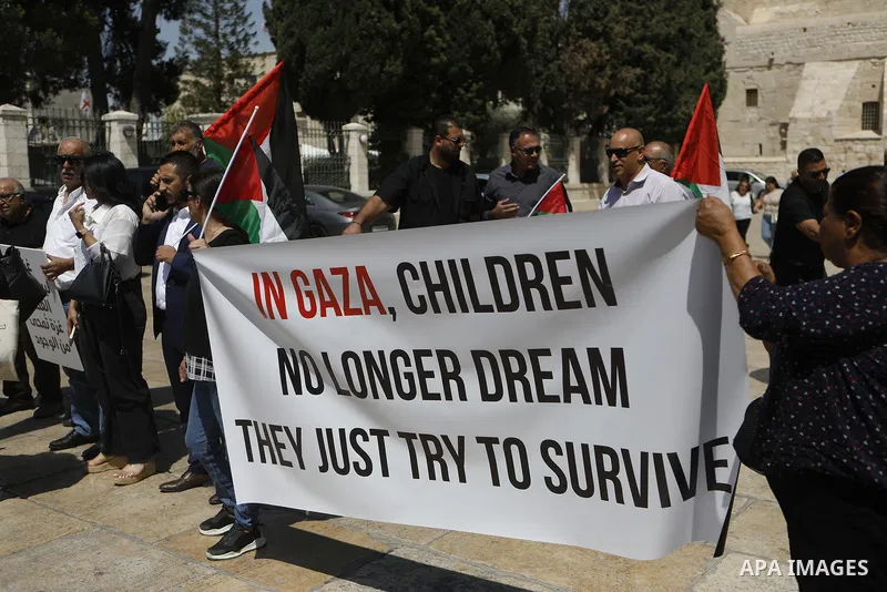 Palestinians take part in a solidarity protest at Manger Square, near the Church of the Nativity in the city of Bethlehem, denouncing the ongoing war on Gaza and rejecting the starvation policy imposed on the population...