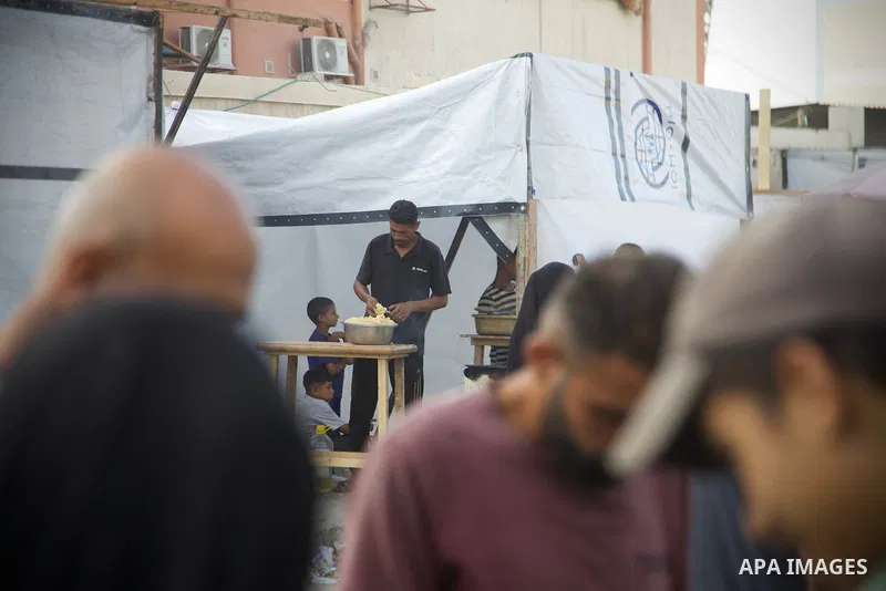 Palestinians, deprived of basic necessities such as shelter, food, and clean water due to ongoing Israeli attacks, buy falafel from street vendors, as it is currently the most affordable and available food option amid se...