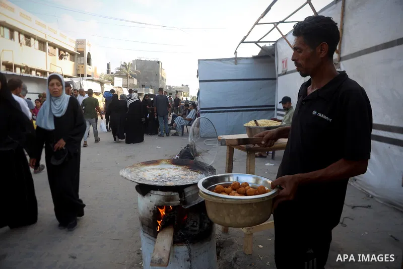 Palestinians, deprived of basic necessities such as shelter, food, and clean water due to ongoing Israeli attacks, buy falafel from street vendors, as it is currently the most affordable and available food option amid se...