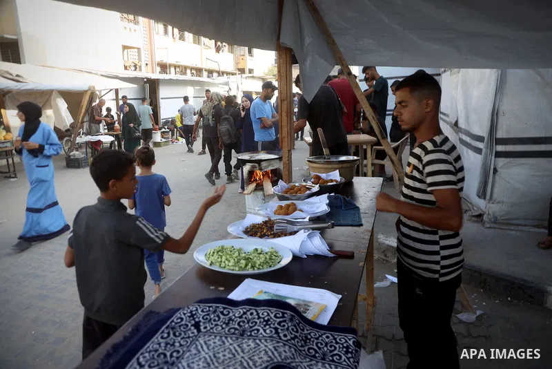 Palestinians, deprived of basic necessities such as shelter, food, and clean water due to ongoing Israeli attacks, buy falafel from street vendors, as it is currently the most affordable and available food option amid se...