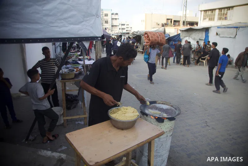 Palestinians, deprived of basic necessities such as shelter, food, and clean water due to ongoing Israeli attacks, buy falafel from street vendors, as it is currently the most affordable and available food option amid se...