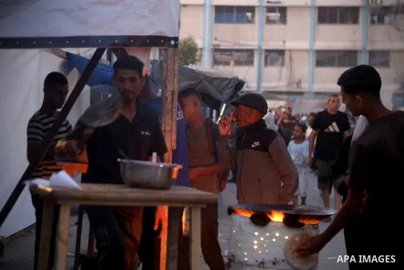 Palestinians, deprived of basic necessities such as shelter, food, and clean water due to ongoing Israeli attacks, buy falafel from street vendors, as it is currently the most affordable and available food option amid se...