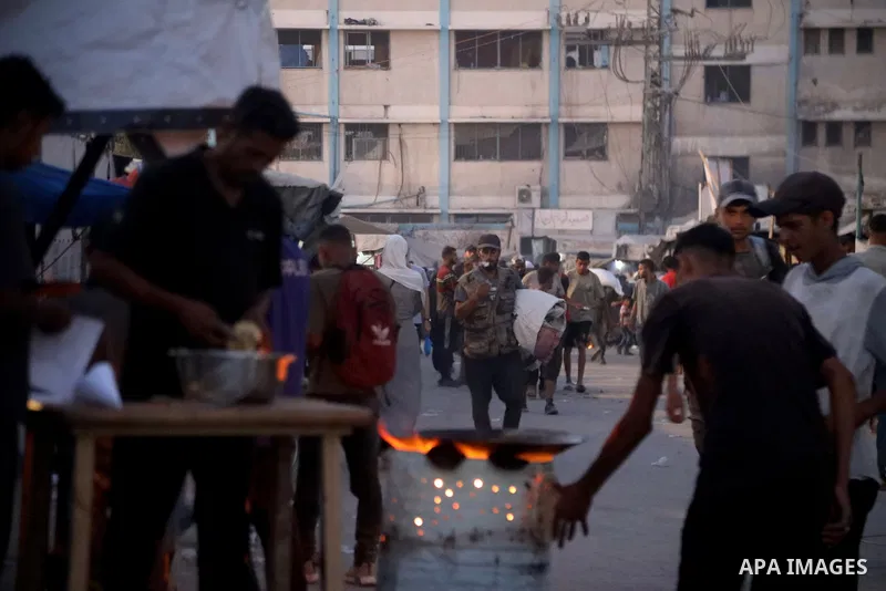 Palestinians, deprived of basic necessities such as shelter, food, and clean water due to ongoing Israeli attacks, buy falafel from street vendors, as it is currently the most affordable and available food option amid se...