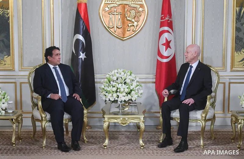 Tunisian President, Kais Saied, receives Libyan Presidential Council Chairman Mohamed Younis Menfi at Tunis-Carthage International Airport in Tunisia on August 18, 2025. Photo by Tunisian Presidency\ apaimages