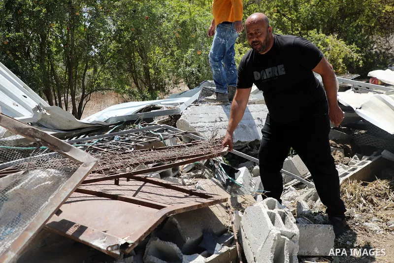 Palestinians inspect a building demolished by Israeli authorities in the village of Burqa, north of Nablus, West Bank.August 25, 2025. Photo by Mohammed Nasser\ apaimages
