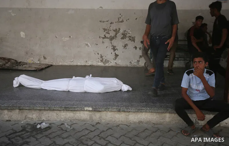 Relatives of the Palestinians, including children, who died as a result of Israeli attacks on different parts of Gaza City, mourn as the dead bodies were taken from the al-Ahly Hospital for burial in Gaza City, Gaza on A...