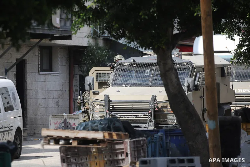 Israeli army forces raid the home of a Palestinian wanted by the Israeli army in the Balata refugee camp east of Nablus in the West Bank. During the raid, a Palestinian was killed and the wanted Palestinian was arrested...