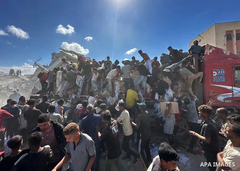 Aid trucks belonging to the United Nations World Food Programme (WFP) move from the Kerem Shalom border crossing toward Khan Younis city center to distribute food aid as part of efforts to alleviate the humanitarian cris...