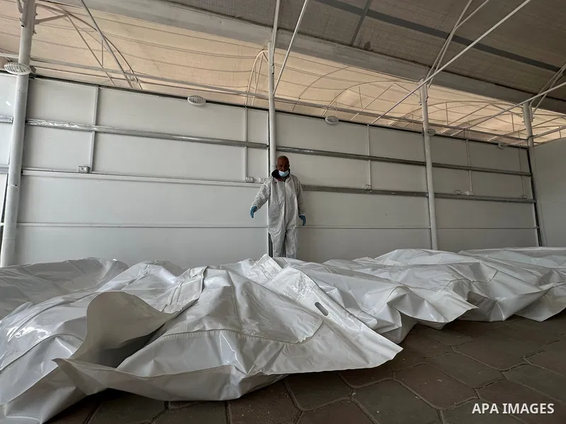 Red Cross teams deliver the bodies of 30 Palestinians, who were detained by Israeli forces from different parts of Gaza during the war and handed over as part of the ceasefire deal, to Nasser Hospital in Khan Yunis, Gaza...