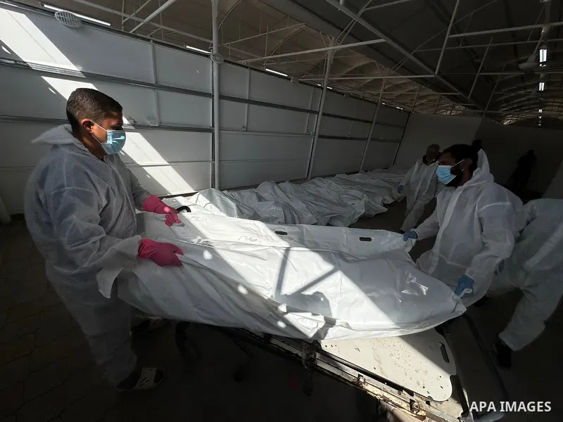 Red Cross teams deliver the bodies of 30 Palestinians, who were detained by Israeli forces from different parts of Gaza during the war and handed over as part of the ceasefire deal, to Nasser Hospital in Khan Yunis, Gaza...