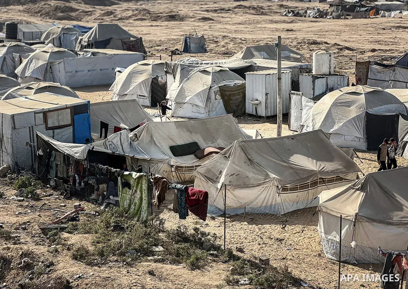 Displaced Palestinian families, including orphans, live in a temporary camp within Al-Bureij refugee camp in central Gaza, where worn-out tents have become their only shelter after losing their homes and loved ones durin...