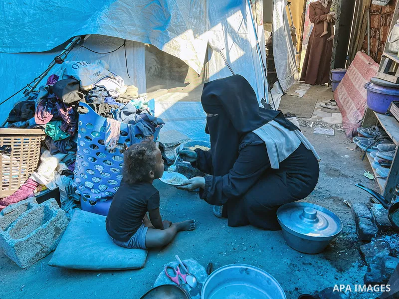 Displaced Palestinian families, including orphans, live in a temporary camp within Al-Bureij refugee camp in central Gaza, where worn-out tents have become their only shelter after losing their homes and loved ones durin...