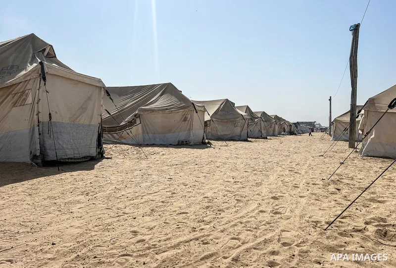 Displaced Palestinian families, including orphans, live in a temporary camp within Al-Bureij refugee camp in central Gaza, where worn-out tents have become their only shelter after losing their homes and loved ones durin...