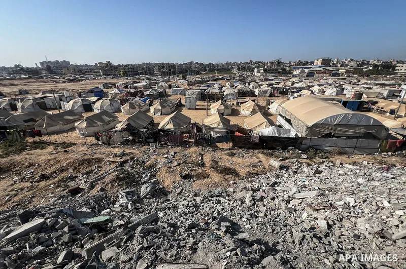 Displaced Palestinian families, including orphans, live in a temporary camp within Al-Bureij refugee camp in central Gaza, where worn-out tents have become their only shelter after losing their homes and loved ones durin...