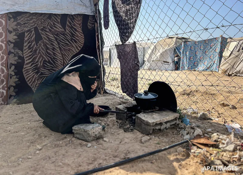 Displaced Palestinian families, including orphans, live in a temporary camp within Al-Bureij refugee camp in central Gaza, where worn-out tents have become their only shelter after losing their homes and loved ones durin...