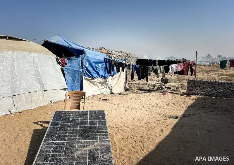 Displaced Palestinian families, including orphans, live in a temporary camp within Al-Bureij refugee camp in central Gaza, where worn-out tents have become their only shelter after losing their homes and loved ones durin...