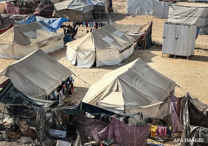 Displaced Palestinian families, including orphans, live in a temporary camp within Al-Bureij refugee camp in central Gaza, where worn-out tents have become their only shelter after losing their homes and loved ones durin...