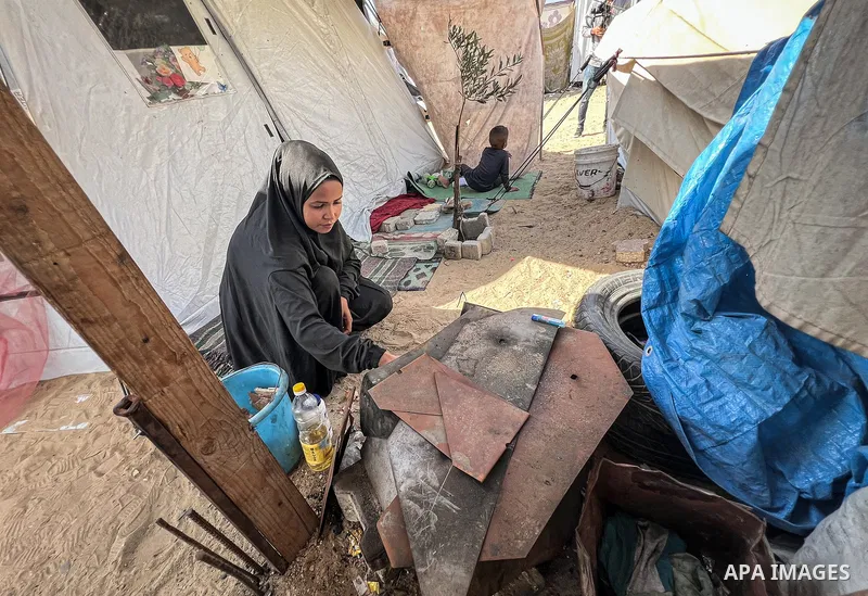 Displaced Palestinian families, including orphans, live in a temporary camp within Al-Bureij refugee camp in central Gaza, where worn-out tents have become their only shelter after losing their homes and loved ones durin...