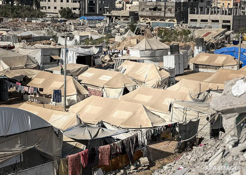 Displaced Palestinian families, including orphans, live in a temporary camp within Al-Bureij refugee camp in central Gaza, where worn-out tents have become their only shelter after losing their homes and loved ones durin...