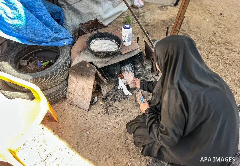Displaced Palestinian families, including orphans, live in a temporary camp within Al-Bureij refugee camp in central Gaza, where worn-out tents have become their only shelter after losing their homes and loved ones durin...