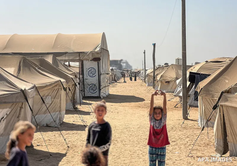 Displaced Palestinian families, including orphans, live in a temporary camp within Al-Bureij refugee camp in central Gaza, where worn-out tents have become their only shelter after losing their homes and loved ones durin...