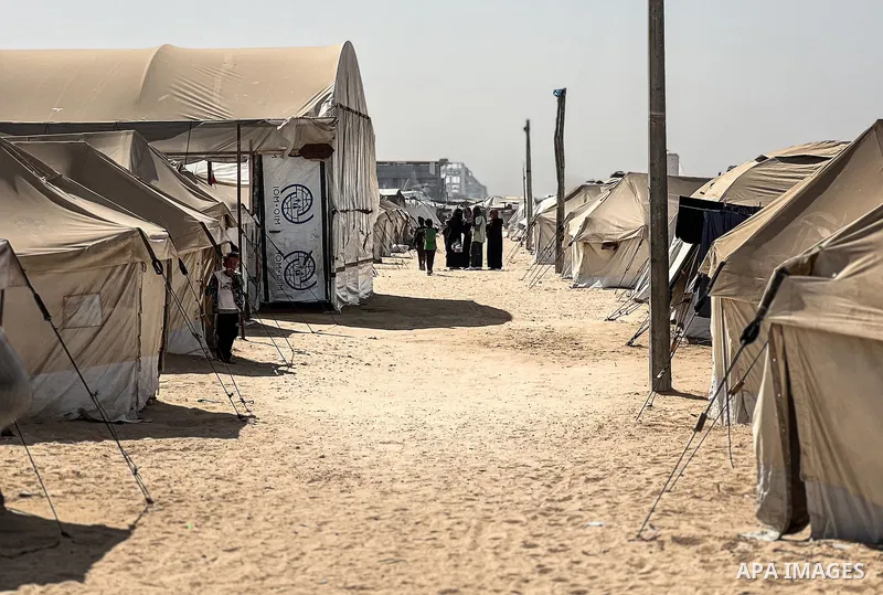 Displaced Palestinian families, including orphans, live in a temporary camp within Al-Bureij refugee camp in central Gaza, where worn-out tents have become their only shelter after losing their homes and loved ones durin...