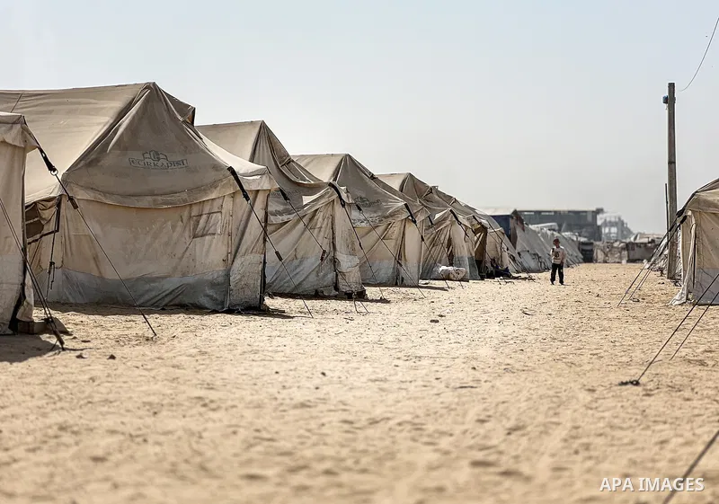Displaced Palestinian families, including orphans, live in a temporary camp within Al-Bureij refugee camp in central Gaza, where worn-out tents have become their only shelter after losing their homes and loved ones durin...