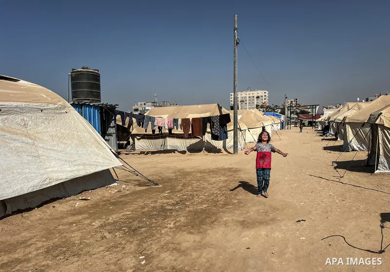Displaced Palestinian families, including orphans, live in a temporary camp within Al-Bureij refugee camp in central Gaza, where worn-out tents have become their only shelter after losing their homes and loved ones durin...
