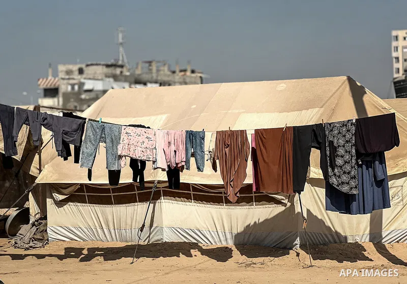Displaced Palestinian families, including orphans, live in a temporary camp within Al-Bureij refugee camp in central Gaza, where worn-out tents have become their only shelter after losing their homes and loved ones durin...