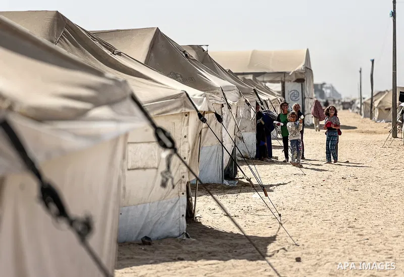 Displaced Palestinian families, including orphans, live in a temporary camp within Al-Bureij refugee camp in central Gaza, where worn-out tents have become their only shelter after losing their homes and loved ones durin...