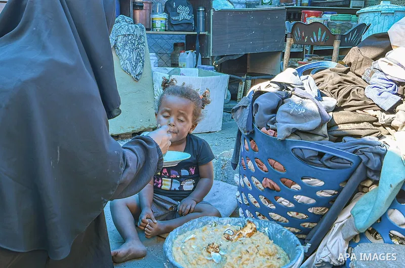 Displaced Palestinian families, including orphans, live in a temporary camp within Al-Bureij refugee camp in central Gaza, where worn-out tents have become their only shelter after losing their homes and loved ones durin...