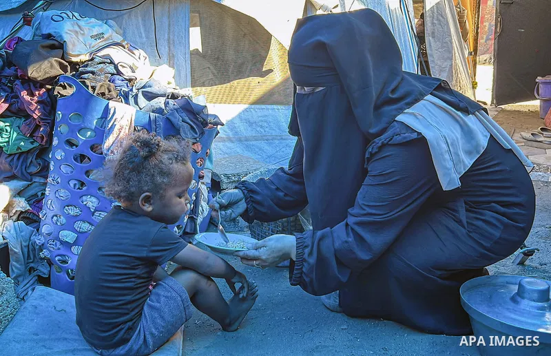 Displaced Palestinian families, including orphans, live in a temporary camp within Al-Bureij refugee camp in central Gaza, where worn-out tents have become their only shelter after losing their homes and loved ones durin...