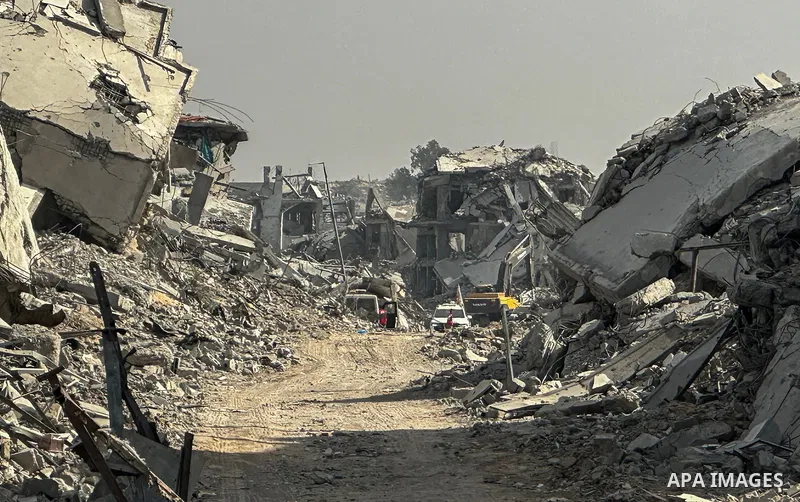 Machinery is working alongside a Red Cross vehicle in the area known as the "Yellow Line," to which Israeli forces withdrew under the ceasefire, where Hamas says it is continuing to search for the bodies of prisoners cap...